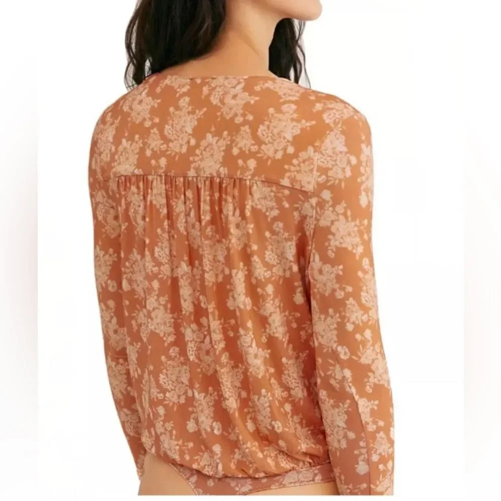 NWT-FREE PEOPLE Turnt Bodysuit